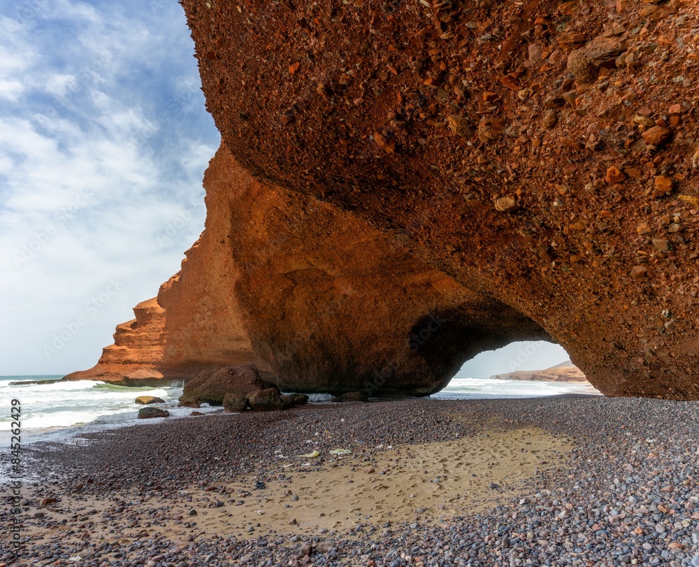 Poster view of the beach and rock arch at Legzira on the Atlantic Coast of Morocco