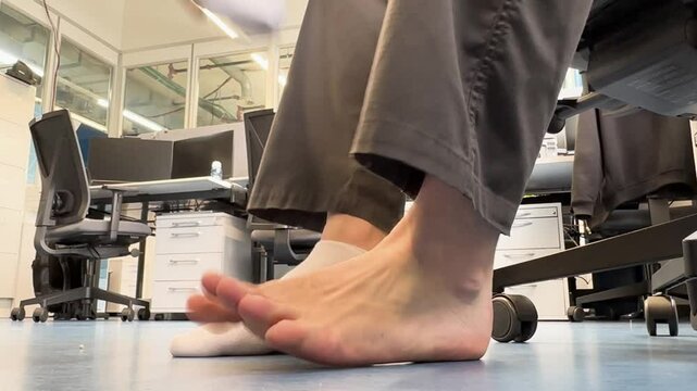 Man takes off socks and massages feet