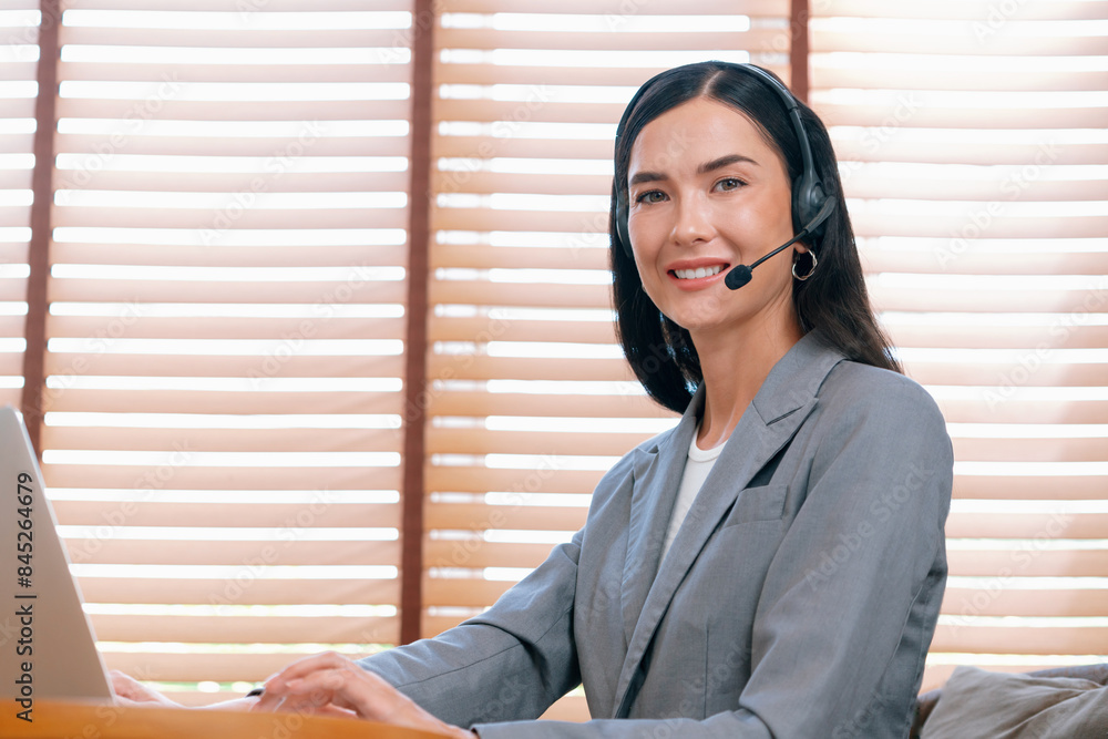 Aufkleber female call center operator or customer service helpdesk staff working on workspace while talking on