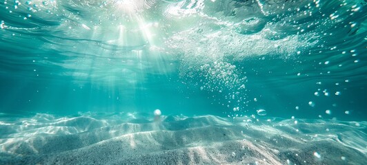 Fototapeta premium Underwater turquoise texture in the ocean. Bubbles in the tropical sea.