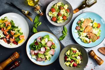 A set of dishes on a served table. Vegetable, meat and seafood dishes. Top view.