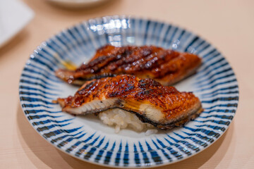 Japanese food style. Eel sushi served on a plate. Eel sushi roll maki.