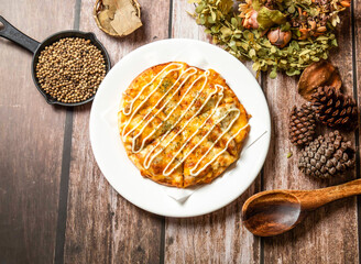 Mayonnaise Pizza with spoon and fork served in plate isolated on wooden table top view of taiwan fasfood