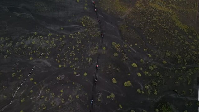 group enduro motorcycles ride on the volcanic sand volcanoes caldera indonesia