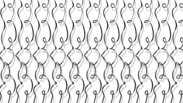 An aluminum or steel fence with curlicues moves in a horizontal direction.