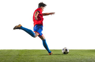 Naklejka premium Back view photo of young soccer football player kicking ball with his leg. Man training in uniform on grass flooring against transparent background. Concept of championship, action, team sport game