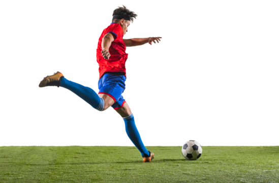 Back view photo of young soccer football player kicking ball with his leg. Man training in uniform on grass flooring against transparent background. Concept of championship, action, team sport game