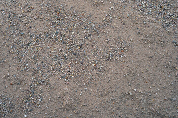 Close-up photo of sand with fine pebbles in it.