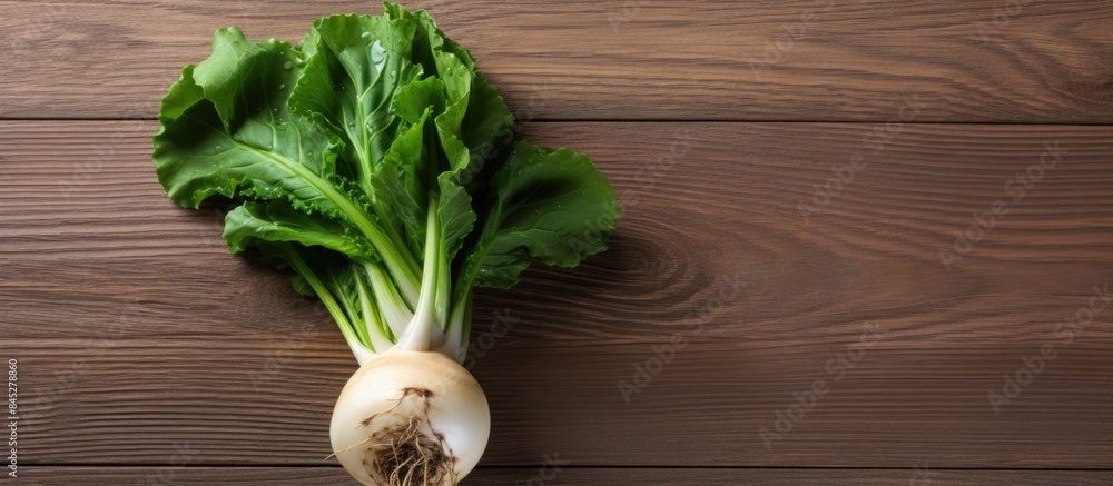 Poster a top view photograph of a vibrant ripe green kohlrabi rests on a wooden table or background the ima