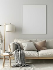 Elegant and stylish living room featuring a blank white frame, cozy sofa with cushions, and a minimalist side table with a lamp Perfect canvas for art