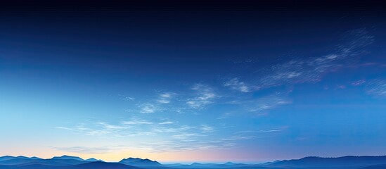 A picturesque panoramic scenery of a clear blue glowing sky during moonrise twilight and night representing concepts of meteorology heaven hope and peace Ideal for graphic resources and copy space im