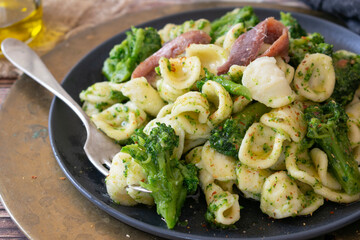 Orecchiette pasta with broccoli, anchovies and chilli pepper, traditional Italian dish from the Puglia region