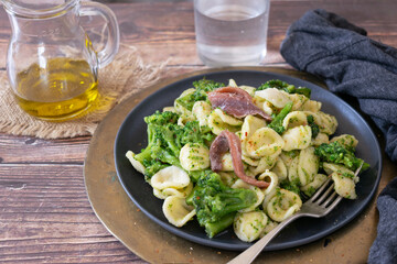 Orecchiette pasta with broccoli, anchovies and chilli pepper, traditional Italian dish from the Puglia region