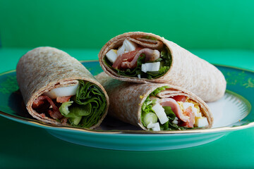 Whole meal wraps filed with bacon,egg and salad.