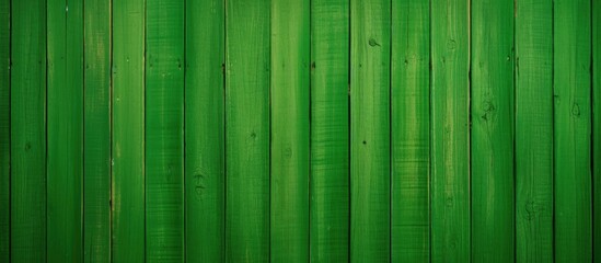 A green wooden background with vertical planks creates a textured wallpaper in a panoramic web format perfect as a header for your copy space image 140 characters