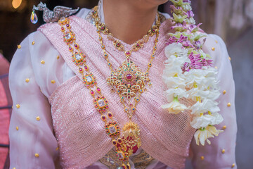 Pretty Asian Woman in Elegant Traditional Thai National Costume. Beautiful traditional Thai dresses by Asian Buddhists at Wat Pa Pao the ancient Myanmar Buddhist temple Chiang Mai, Thailand.