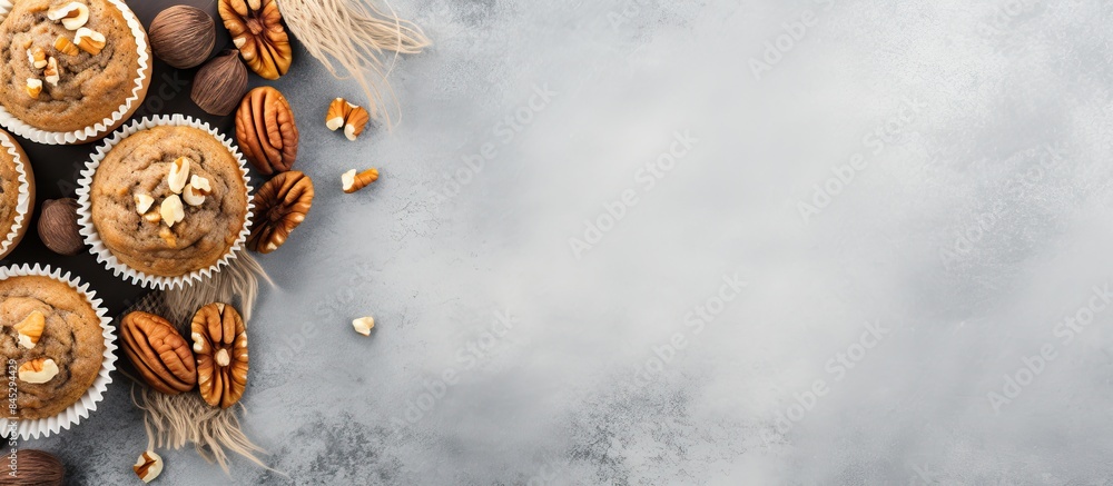 Aufkleber Top view of healthy banana muffins with oatmeal walnuts and cinnamon in baking form on a gray concrete background creating a copy space image