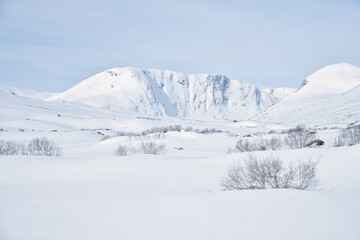 Norwegian high mountains in the snow. Mountains covered with snow. Scandinavia