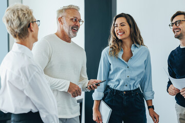 Happy finance professionals having a meeting together in an office