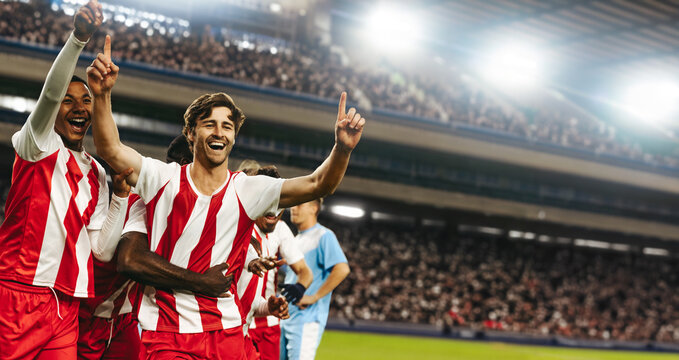 Fototapeta Football team celebrating victory in a professional match at a large stadium