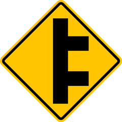 Unregulated intersection with an adjacent road. From right side. Sign for merging road on right side. Road junction. A junction where one street or road intersects another. Warning yellow sign.