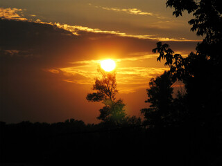 The sun in the sky in the evening at sunset