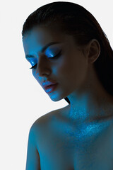 Fototapeta premium Beauty young womans profile, soft blue light, makeup face cosmetic