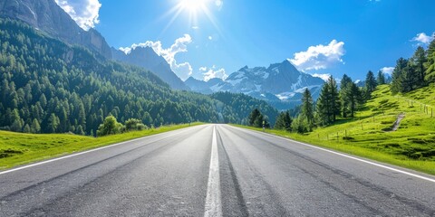Naklejka premium Empty highway between mountain peaks, clear sunny day, incredible nature, bright saturated colors