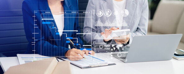 Businesswoman hand Project manager working and update tasks and Gantt chart scheduling virtual diagram.