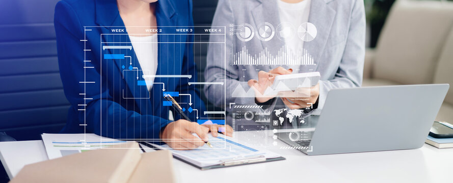 Businesswoman hand Project manager working and update tasks and Gantt chart scheduling virtual diagram.