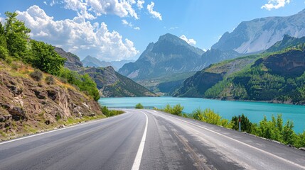 Naklejka premium Empty highway between mountain peaks, lake in the gorge, clear sunny day, incredible nature, bright saturated colors