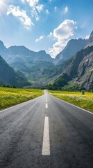 Fototapeta premium Empty highway in the middle of blooming meadows, steep mountain peaks in the background, clear sunny day, bright rays, incredible nature