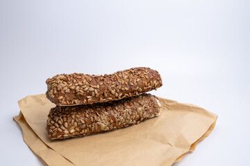 Fresh homemade sourdough bread in kraft packaging with copy space. Nutrition concept