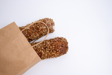 Fresh homemade sourdough bread in kraft packaging with copy space. Nutrition concept