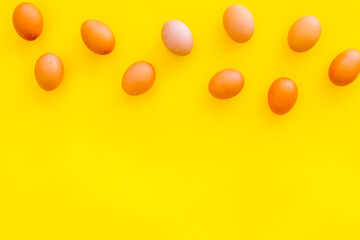 Fresh eggs for organic food on yellow background top view mockup