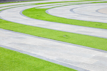 Curve foot path walk way in central garden park grass public area.