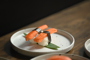 Crab stick Nigiri Sushi serving on white plate. Japanese food concept