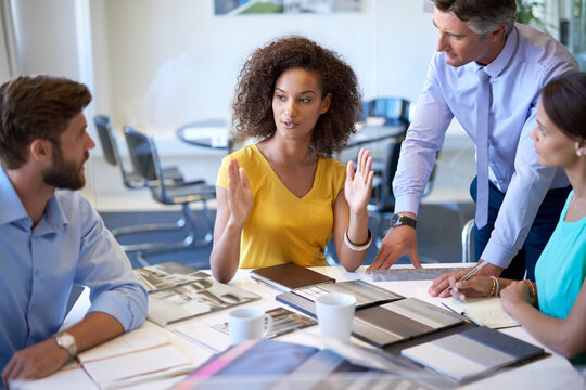 Creative, team and business people with leader for training, coaching or brainstorming in startup. Group, planning and discussion for strategy, project and solution of interior designer in meeting