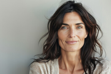 Fototapeta premium A close up portrait of a woman with a subtle smile
