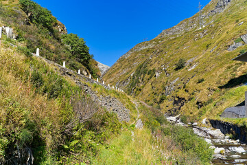 Scenic view of mountain pass road named Tremola at Swiss mountain pass Gotthard on a sunny late summer day. Photo taken September 10th, 2023, Gotthard, Canton Ticino, Switzerland.