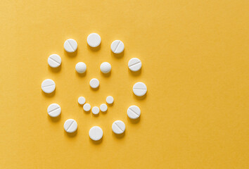 tablets on a yellow background, health and medicine. Positive treatment
