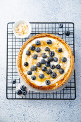 Homemade pumpkin pie with mango, blueberry and honey