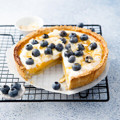 Homemade pumpkin pie with mango, blueberry and honey
