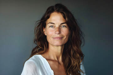 Fototapeta premium A close up portrait of a woman with a subtle smile
