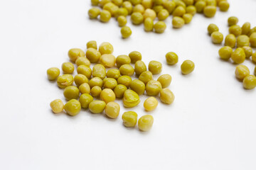 Canned green peas on white background.