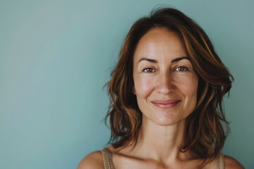 Fototapeta premium A close up portrait of a woman with a subtle smile