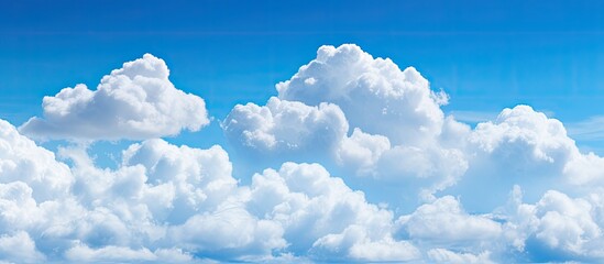 White cumulonimbus clouds in the blue sky. Creative banner. Copyspace image