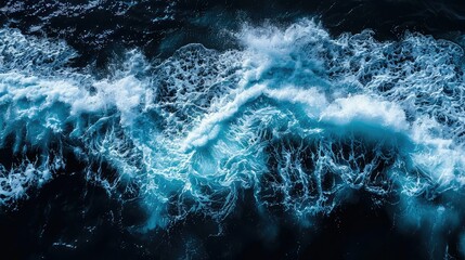Aerial top view background photo of ocean waves splashing in the deep sea. 