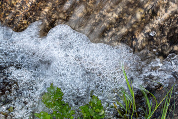 macro of water bubbles by the force current of the river