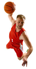 Aerial view of young male basketball player in red gear in mid-jump preparing to dunk ball against transparent background. Concept of professional sport, games, healthy lifestyle, tournament, action. © Lustre Art Group 